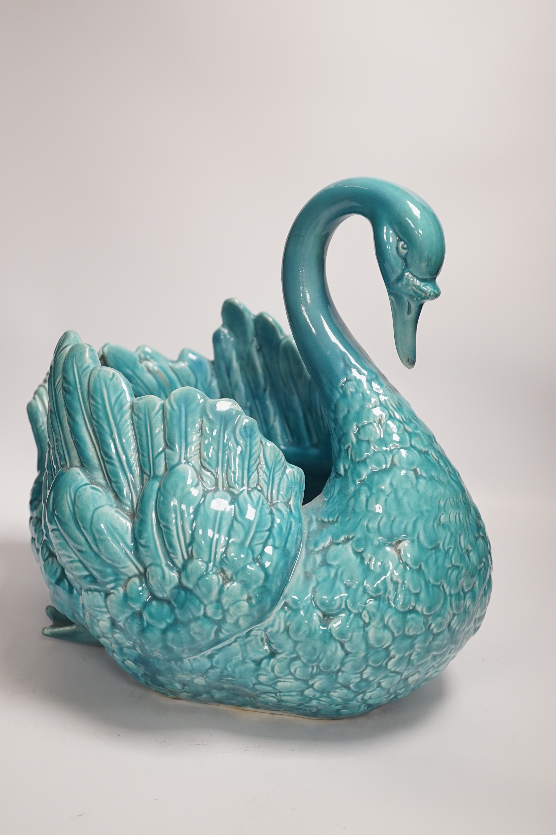 A large turquoise majolica swan, 31.5cm